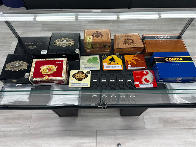 A glass display case filled with different types of cigars