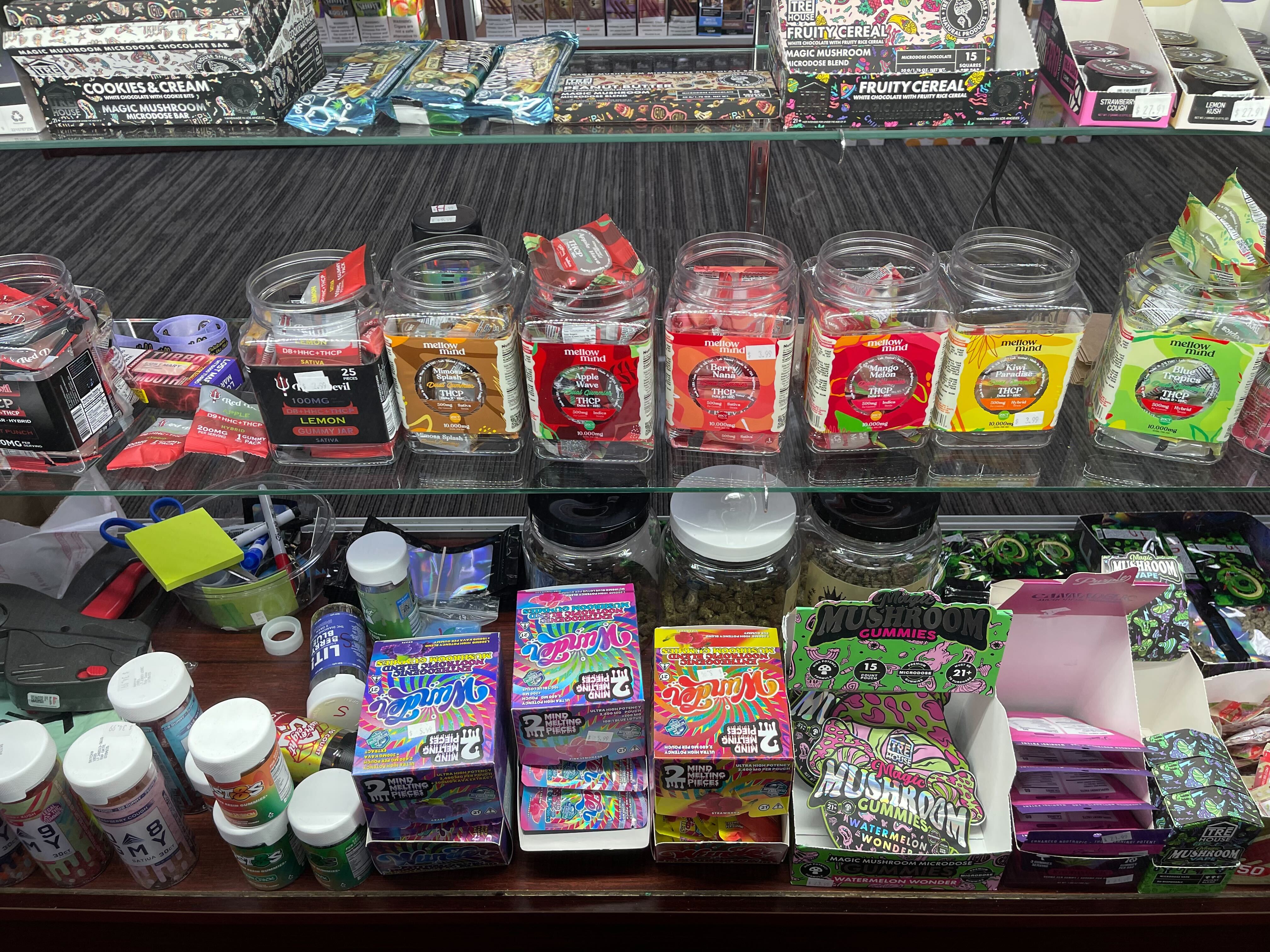 Shelves of cannabis edibles, gummies, and products in colorful packaging