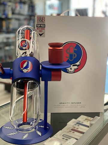 A blue and red coffee maker sitting on top of a counter